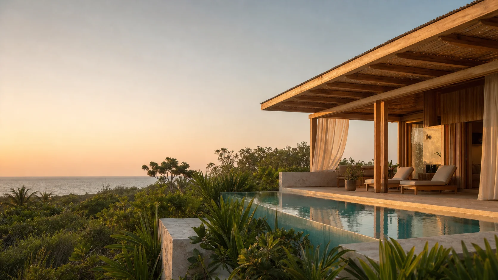 Villa tropical con piscina frente al paisaje del Caribe al atardecer